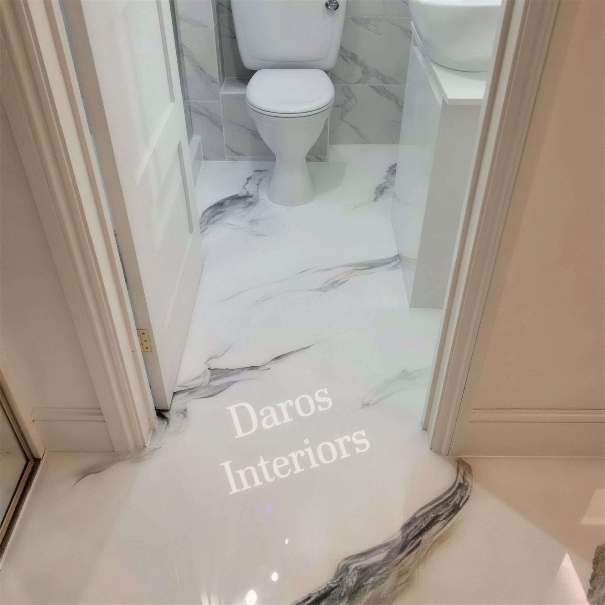 High-gloss white metallic marble-effect floor with charcoal veining flowing through a compact bathroom doorway toward the toilet.