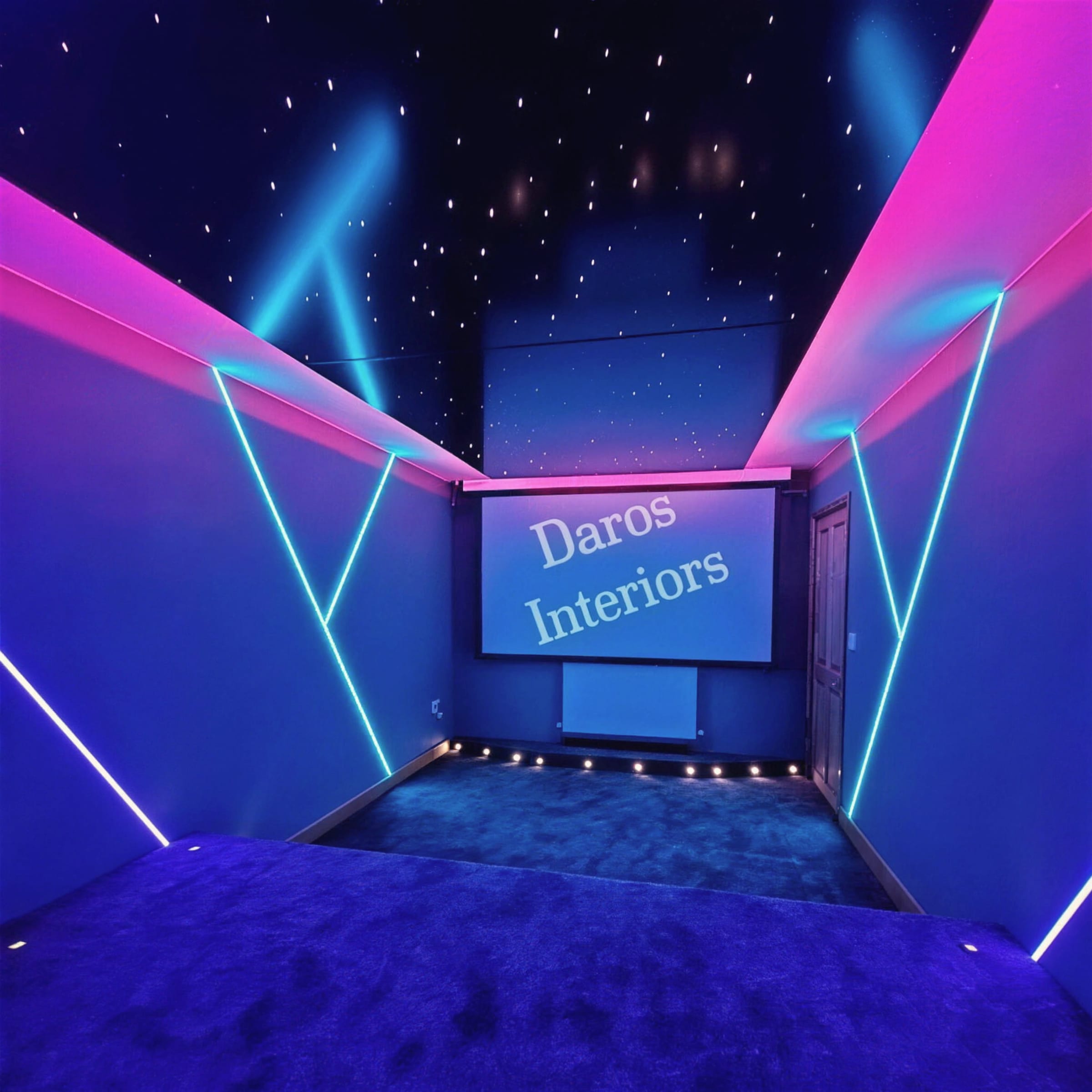 Symmetrical home cinema with a fibre-optic star ceiling, pink and blue neon geometry on the walls, projector screen and deep-blue velvet carpet.