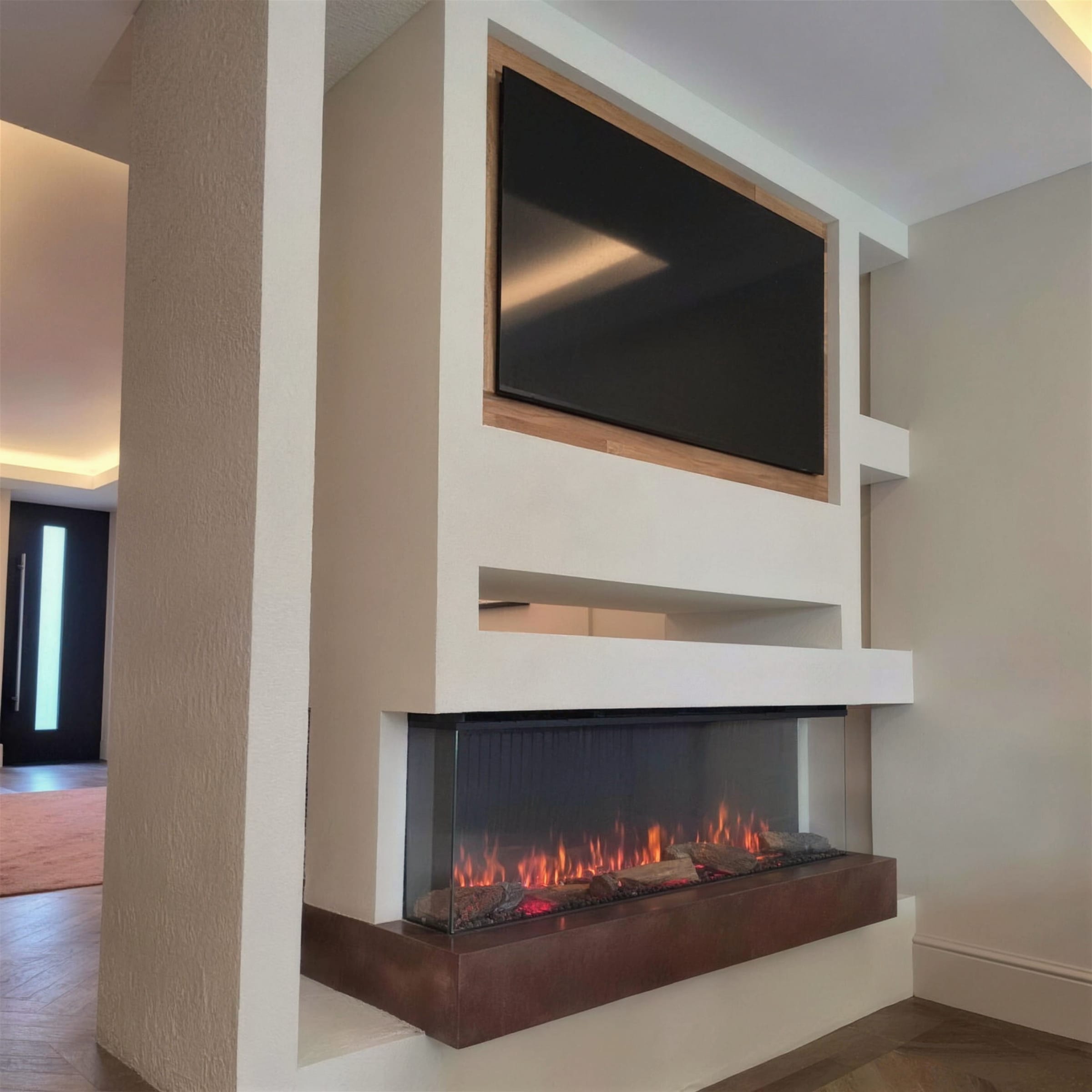 Clean daylight view of a cream plaster media unit with recessed TV and glowing three-sided fireplace above a corten-effect plinth.